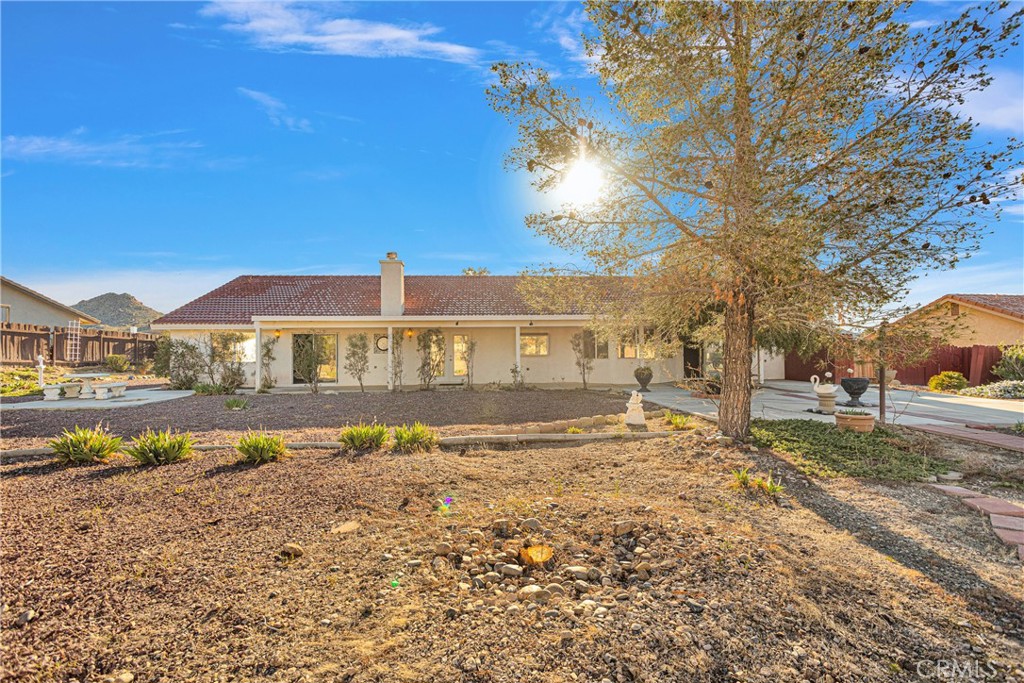 16620 Iwa Road Apple Valley, CA 92307 - Photo 41 of 50 a front view of a house with a yard
