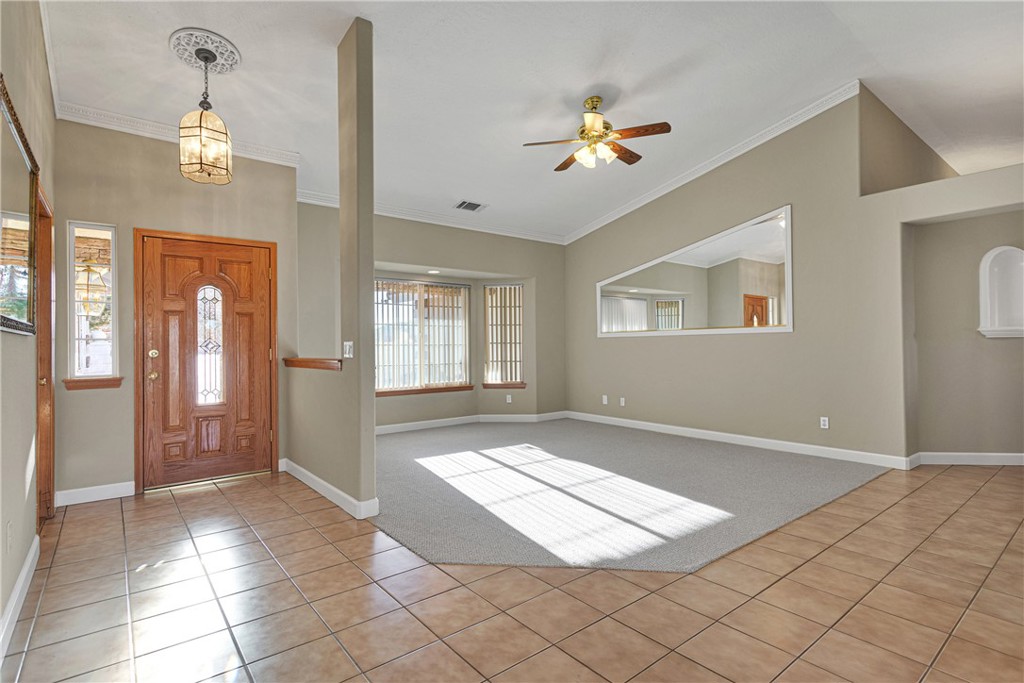 16620 Iwa Road Apple Valley, CA 92307 - Photo 5 of 50 a view of an empty room with window and chandelier fan