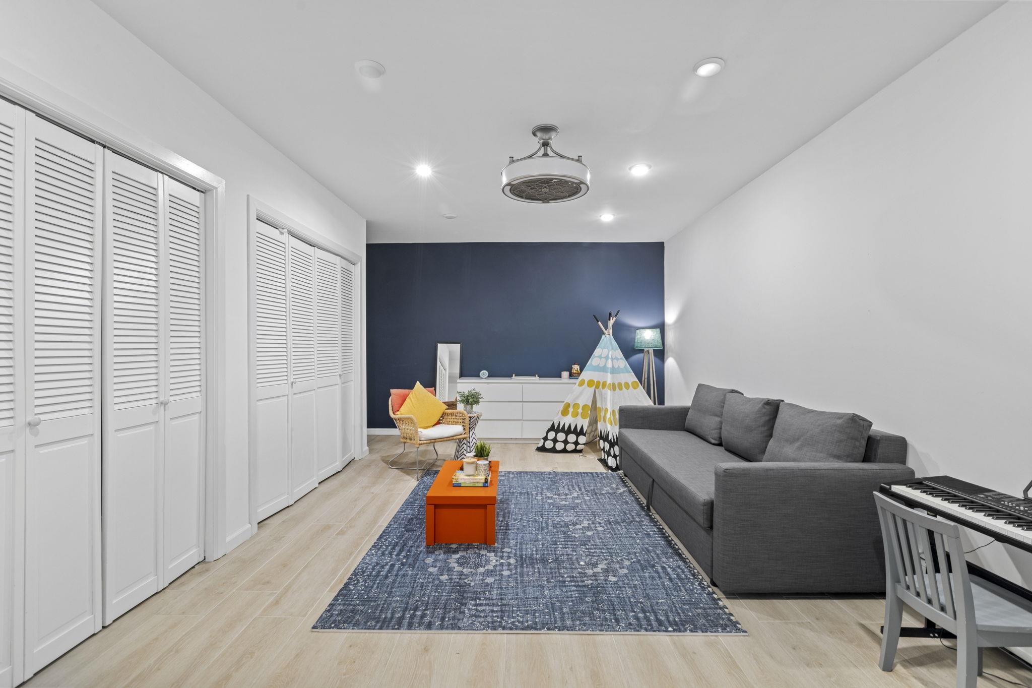 27 Hackensack Plank Road, Unit 1 Weehawken, NJ 07086 - Photo 15 of 23 a living room with furniture and a wooden floor