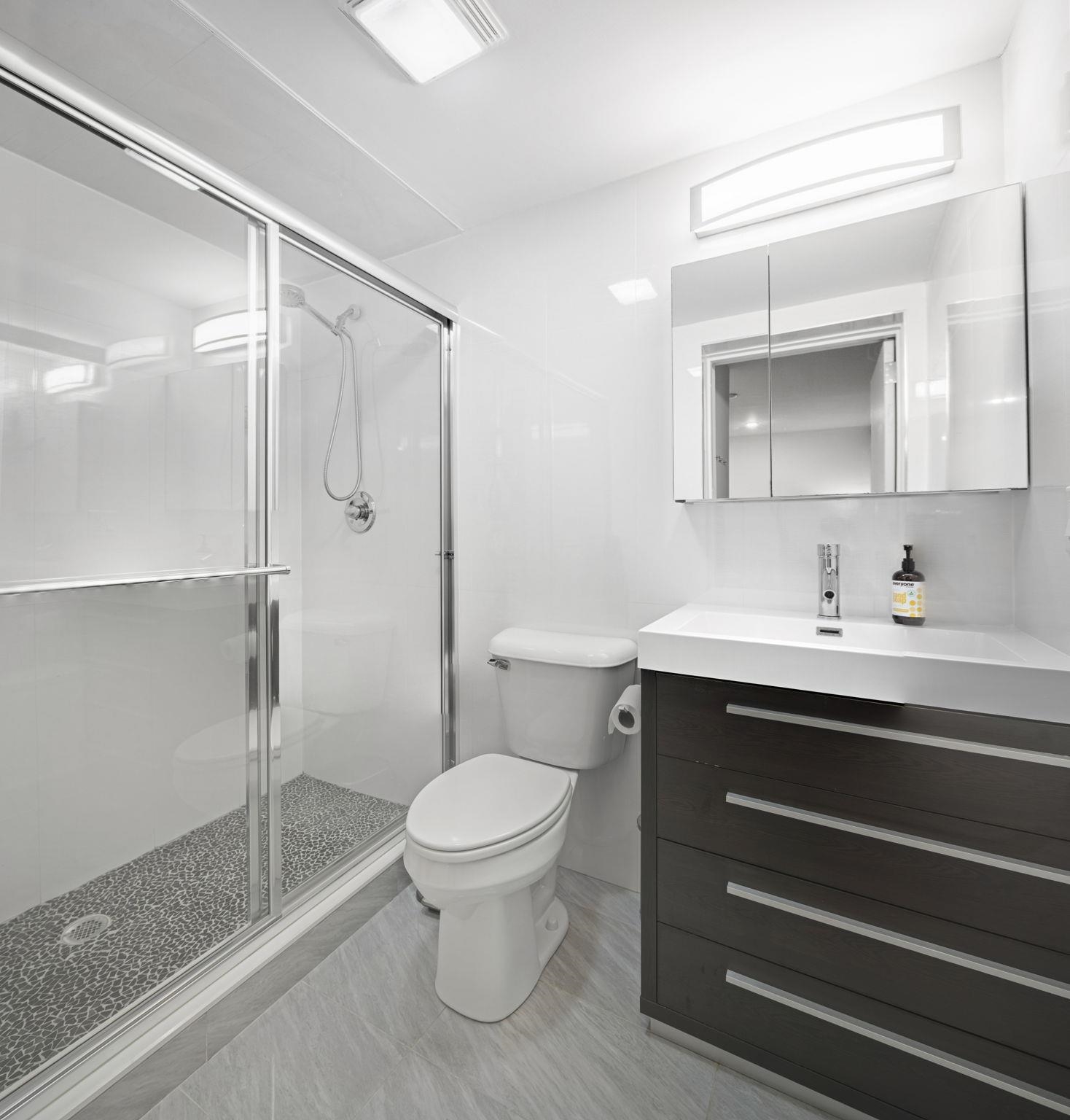 27 Hackensack Plank Road, Unit 1 Weehawken, NJ 07086 - Photo 16 of 23 a bathroom with a sink toilet and shower