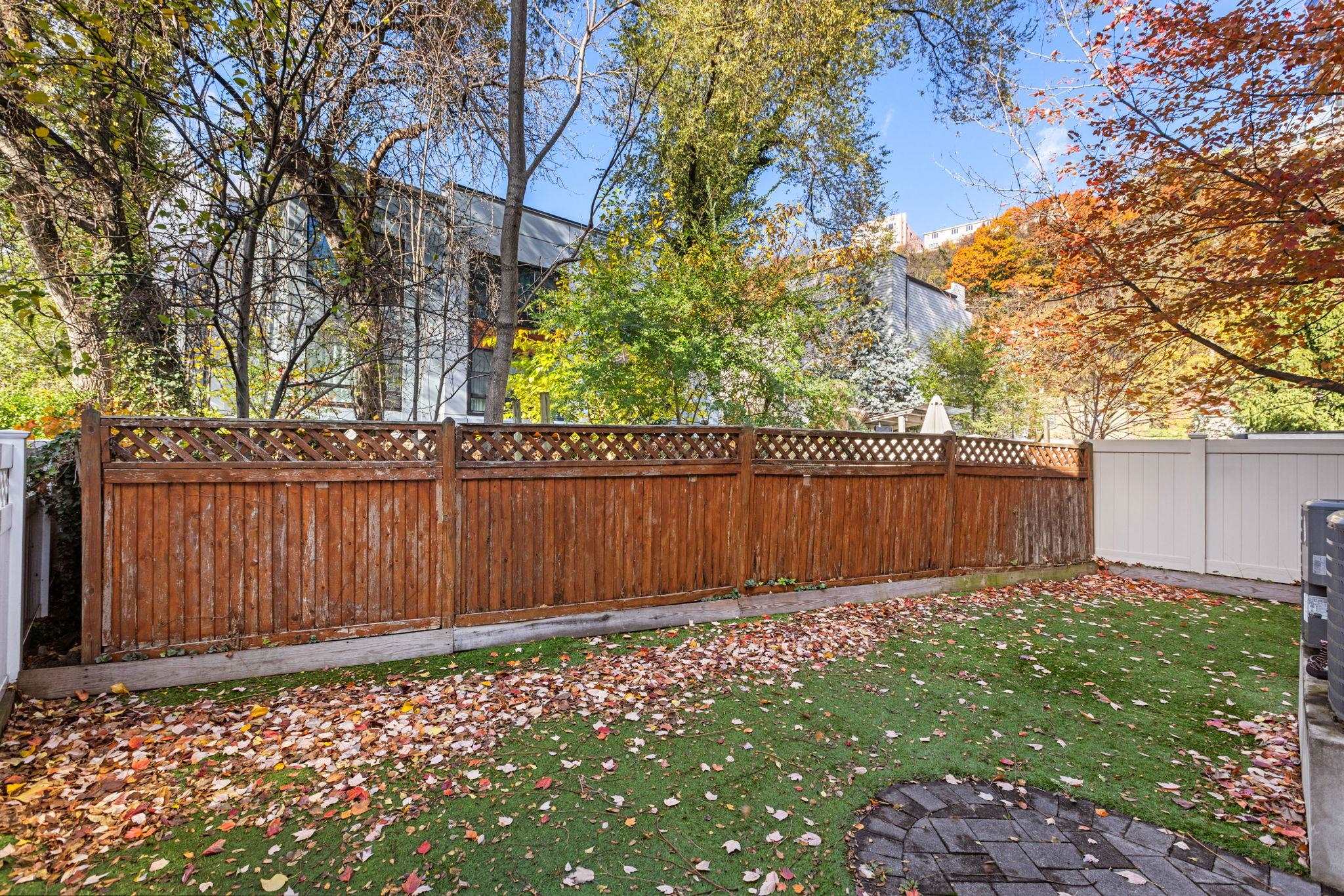 27 Hackensack Plank Road, Unit 1 Weehawken, NJ 07086 - Photo 22 of 23 a view of yard with large trees and wooden fence