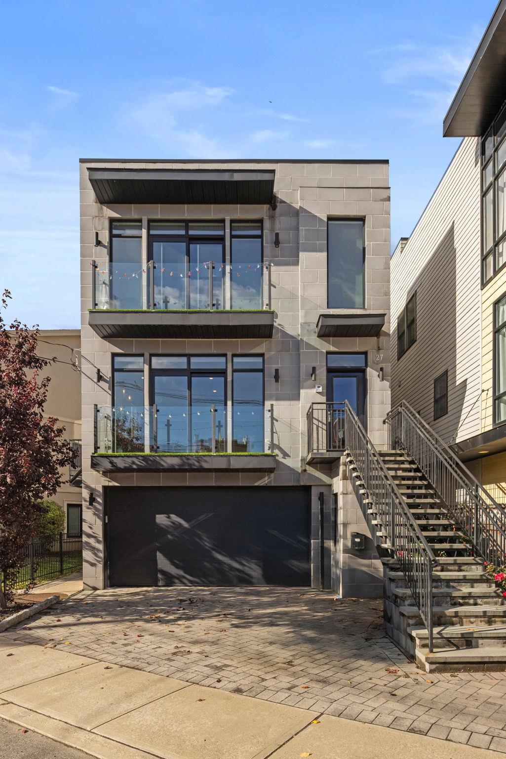 27 Hackensack Plank Road, Unit 1 Weehawken, NJ 07086 - Photo 23 of 23 a front view of a house with lots of windows