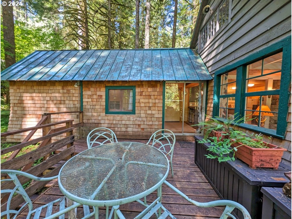 28018 Still Creek Road Rhododendron, OR 97049 - Photo 3 of 36 a backyard of a house with outdoor seating