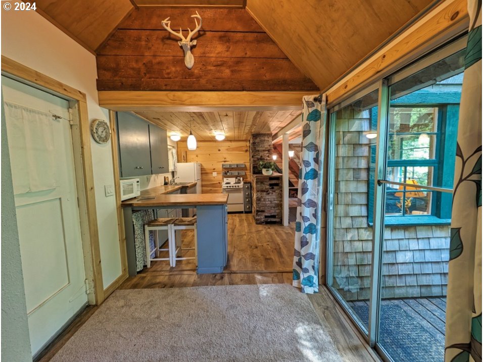 28018 Still Creek Road Rhododendron, OR 97049 - Photo 5 of 36 a view of a hallway with a livingroom