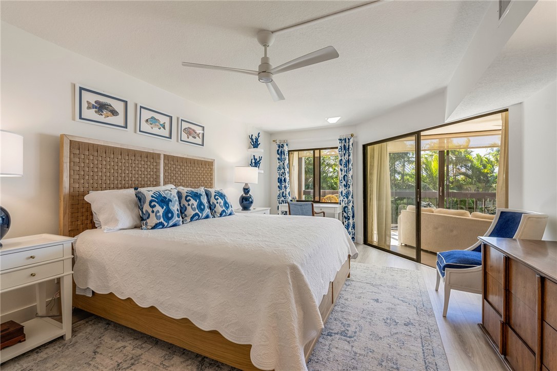 5101 Florida A1A, Unit 108 Vero Beach, FL 32963 - Photo 11 of 31 a bed room with a bed and a large window