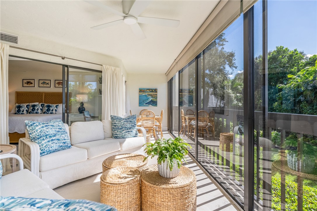 5101 Florida A1A, Unit 108 Vero Beach, FL 32963 - Photo 2 of 31 a living room with furniture and a large window