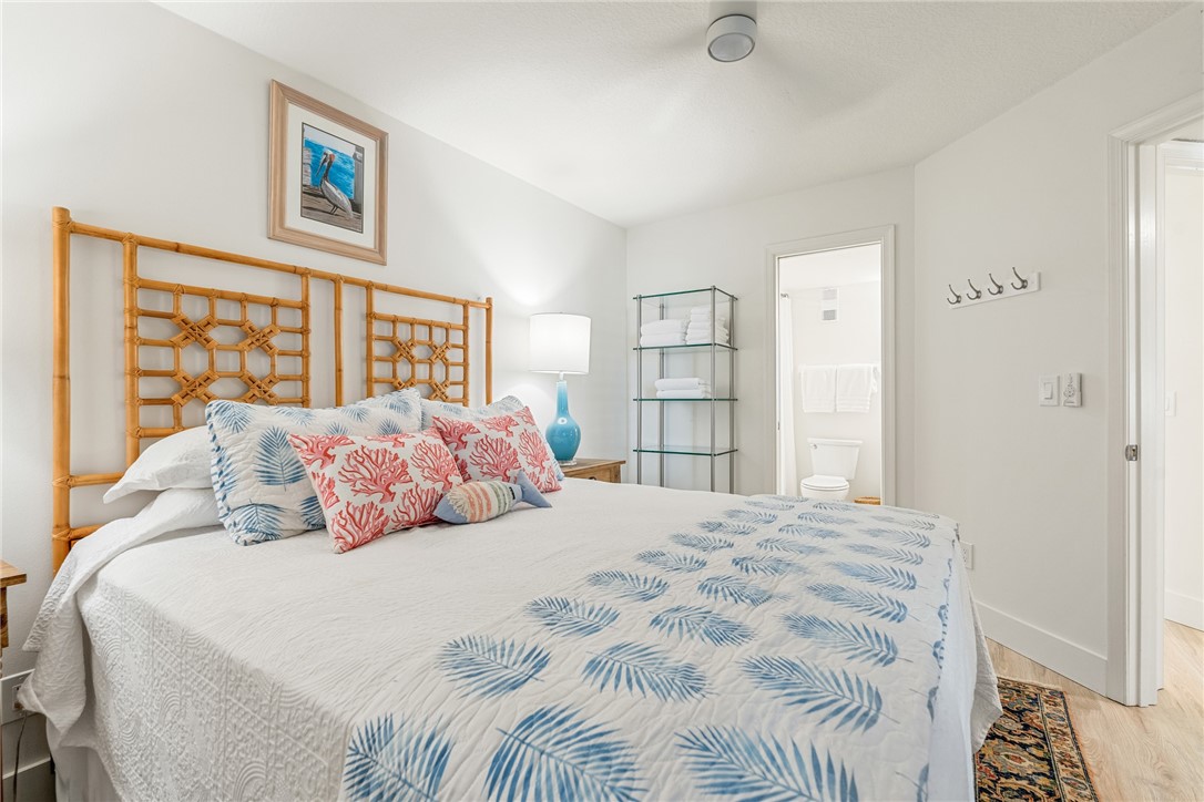 5101 Florida A1A, Unit 108 Vero Beach, FL 32963 - Photo 22 of 31 a bedroom with a bed and a window