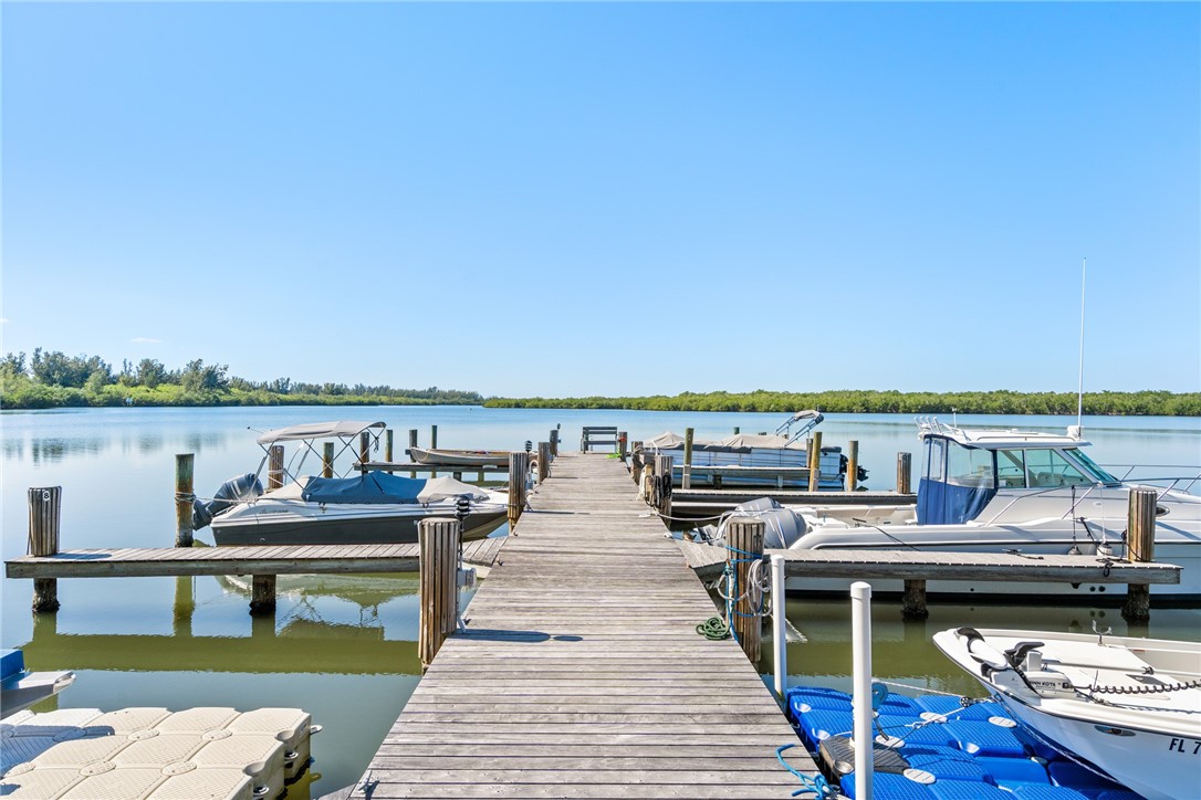 5101 Florida A1A, Unit 108 Vero Beach, FL 32963 - Photo 24 of 31 a view of a balcony with chairs and wooden floor