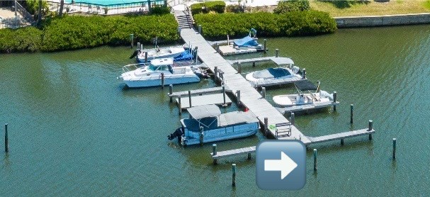 5101 Florida A1A, Unit 108 Vero Beach, FL 32963 - Photo 28 of 31 an aerial view of a house with swimming pool a yard and lake view