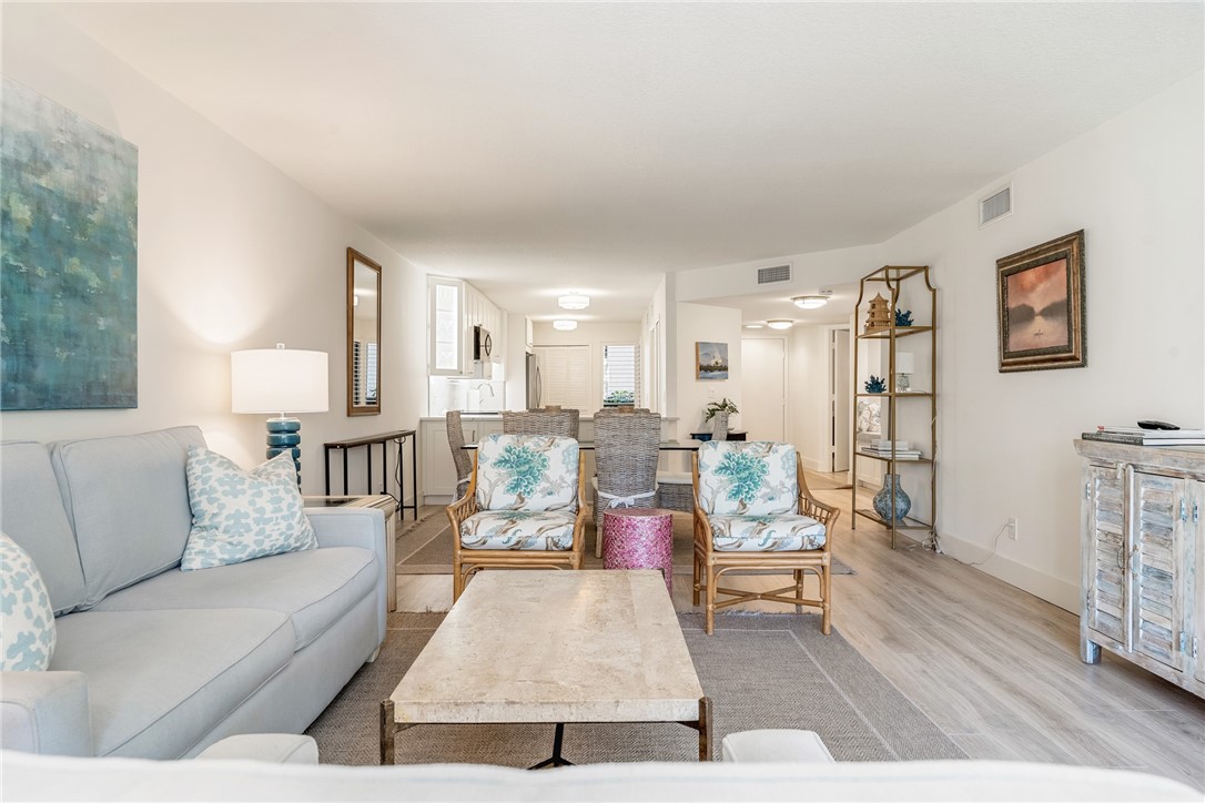 5101 Florida A1A, Unit 108 Vero Beach, FL 32963 - Photo 6 of 31 a living room with furniture and a wooden floor