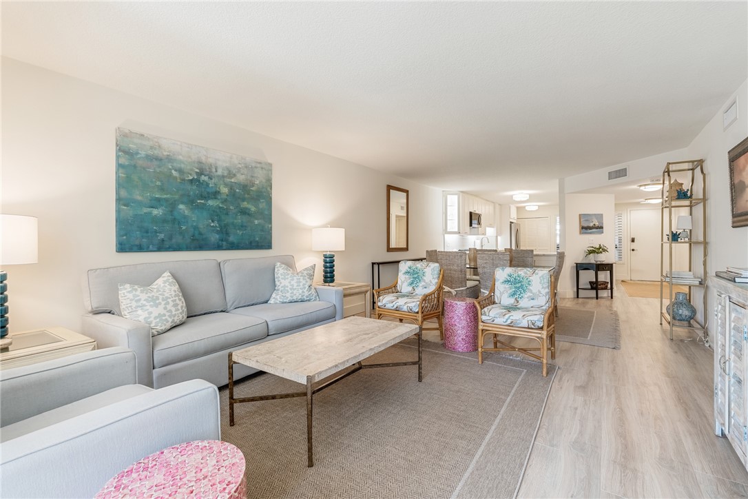 5101 Florida A1A, Unit 108 Vero Beach, FL 32963 - Photo 8 of 31 a living room with furniture and a wooden floor
