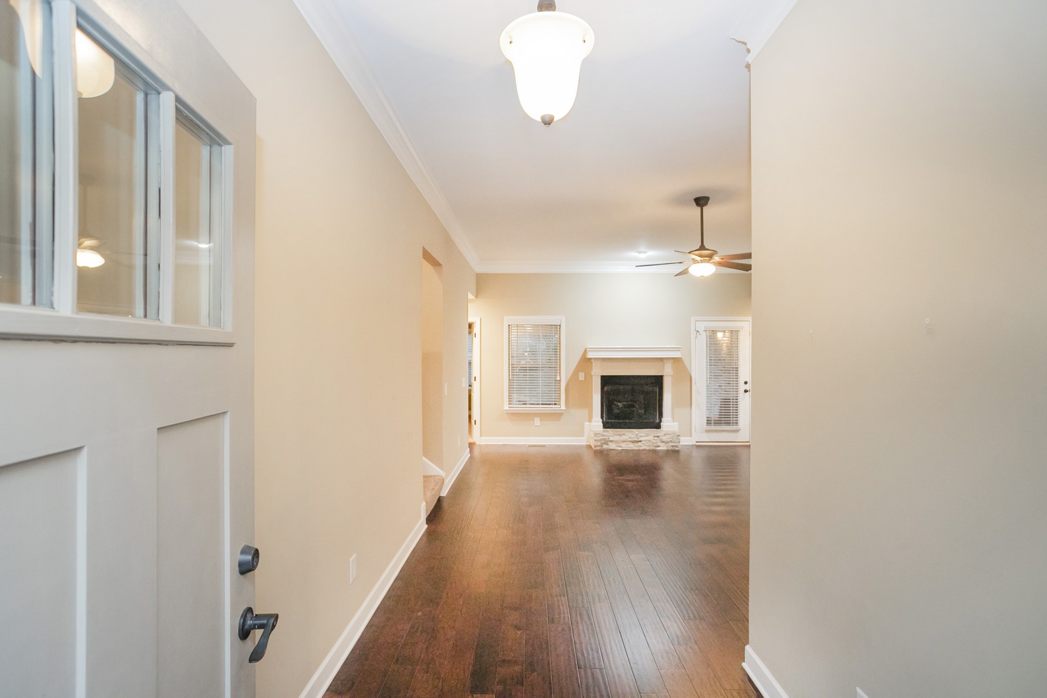 31 Remington Road Lebanon, TN 37090 - Photo 8 of 50 a view of a hallway with wooden floor and a fireplace