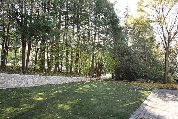 34 Prentice Road Newton, MA 02459 - Photo 3 of 3 a view of a field with trees in the background