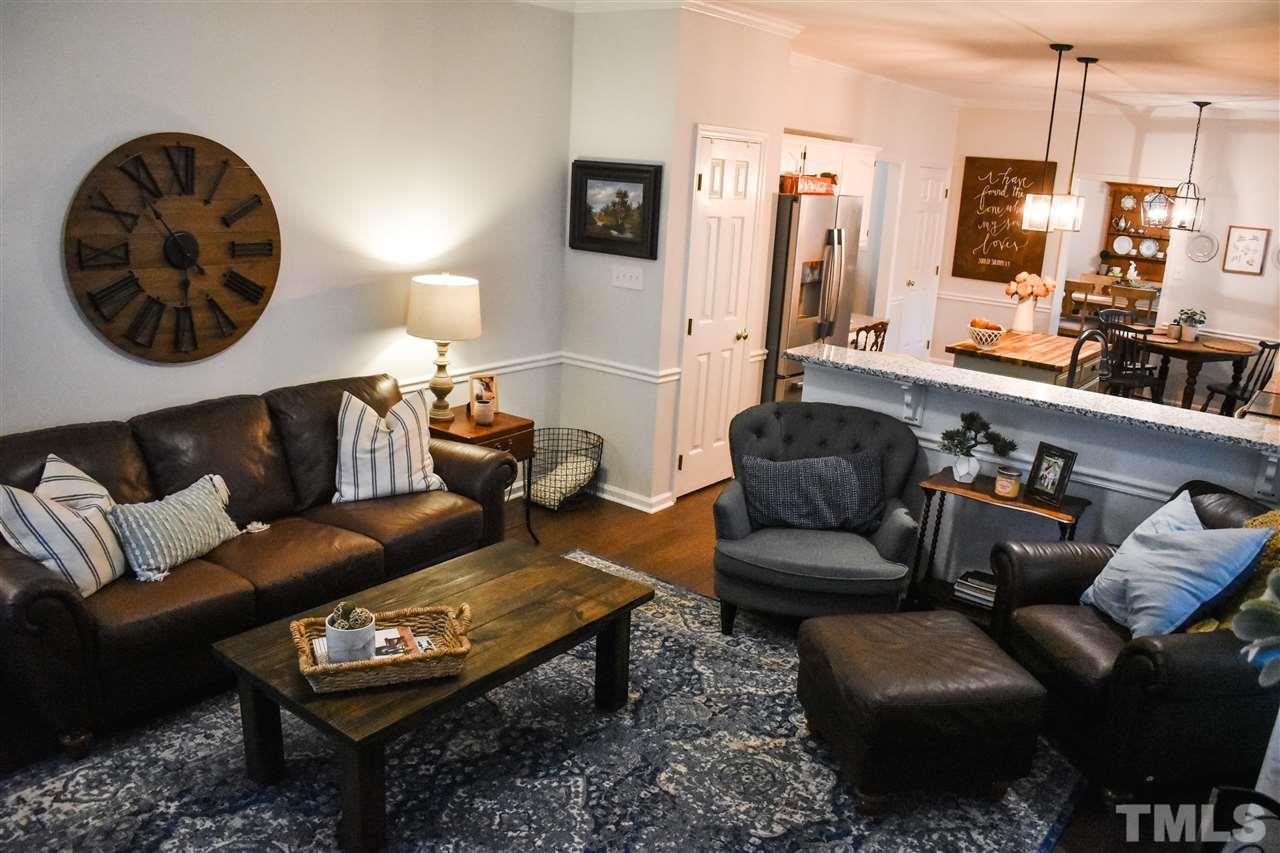 3417 Tunas Street Raleigh, NC 27616 - Photo 15 of 30 a living room with furniture and a flat screen tv