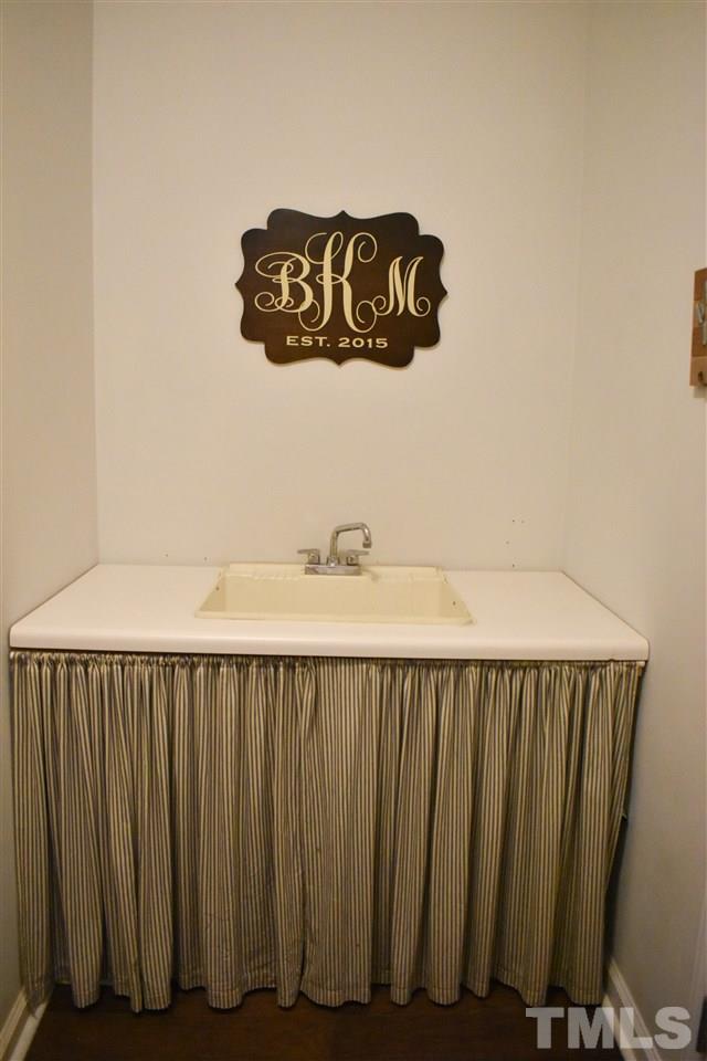 3417 Tunas Street Raleigh, NC 27616 - Photo 18 of 30 a close view of a sink and a mirror