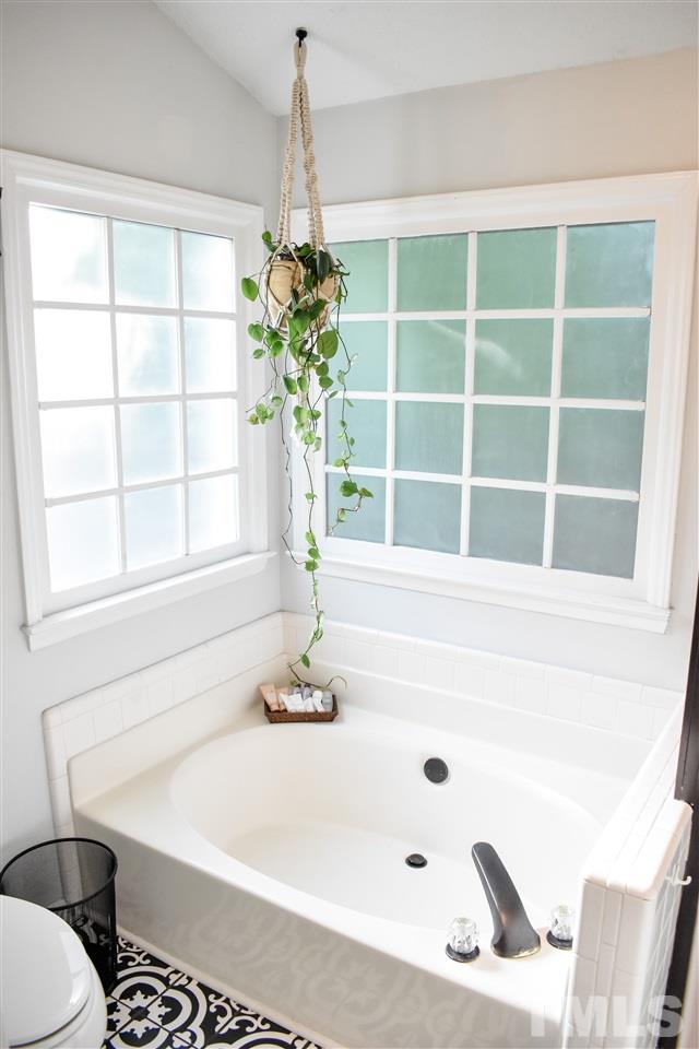 3417 Tunas Street Raleigh, NC 27616 - Photo 21 of 30 a bathroom with a bathtub