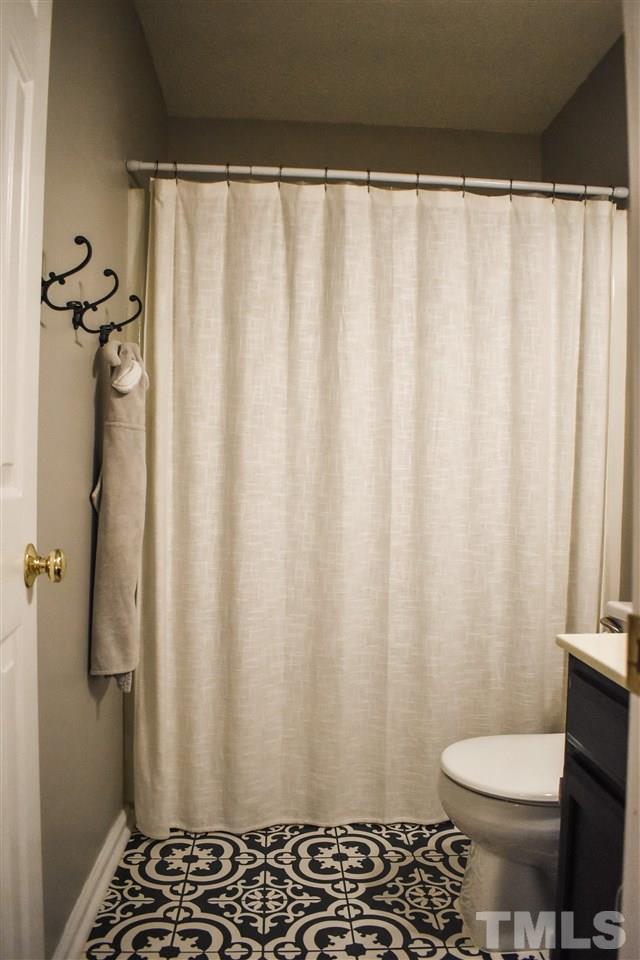 3417 Tunas Street Raleigh, NC 27616 - Photo 27 of 30 a bathroom with a sink and a toilet