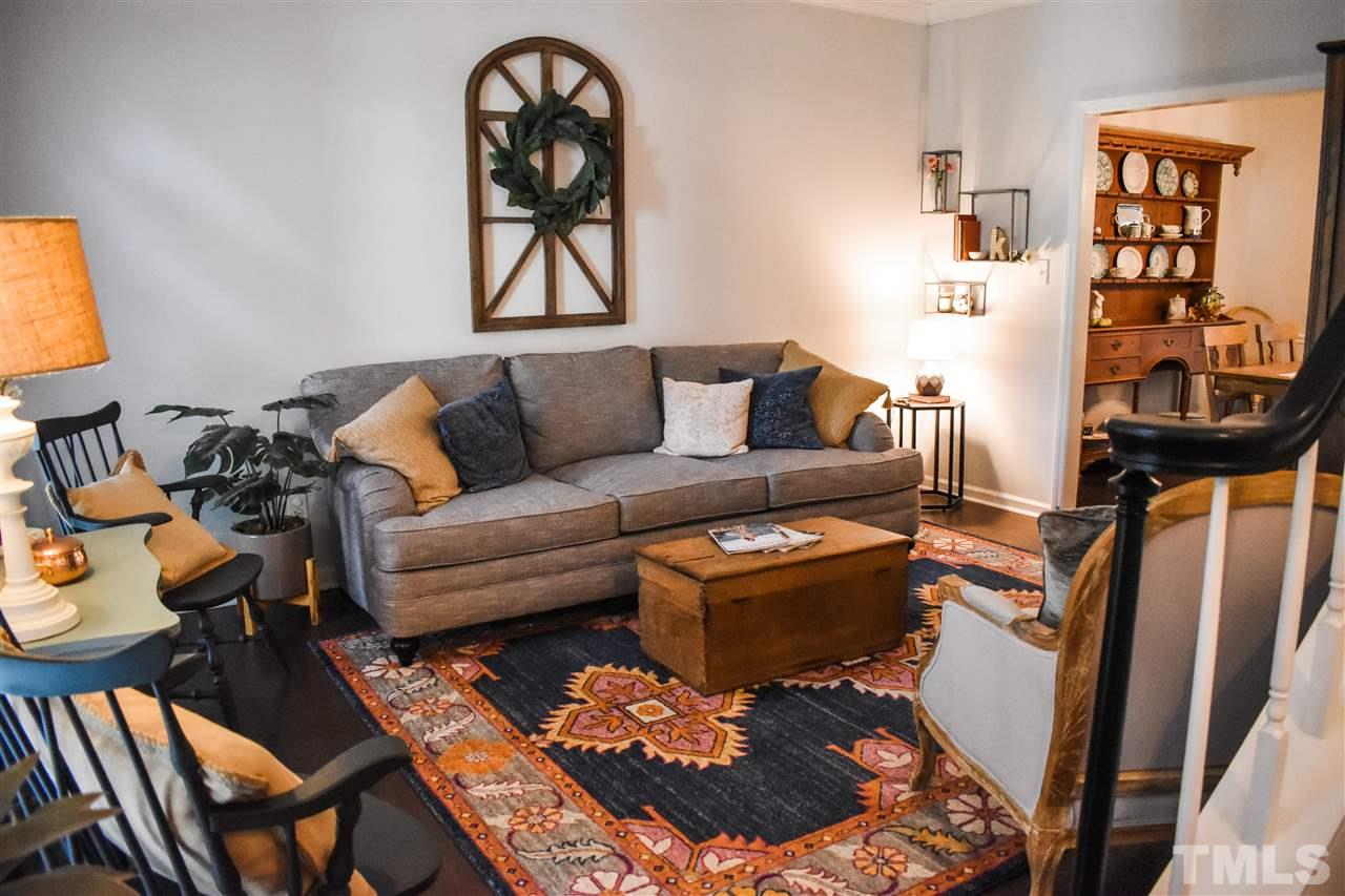 3417 Tunas Street Raleigh, NC 27616 - Photo 5 of 30 a living room with furniture a rug and a window