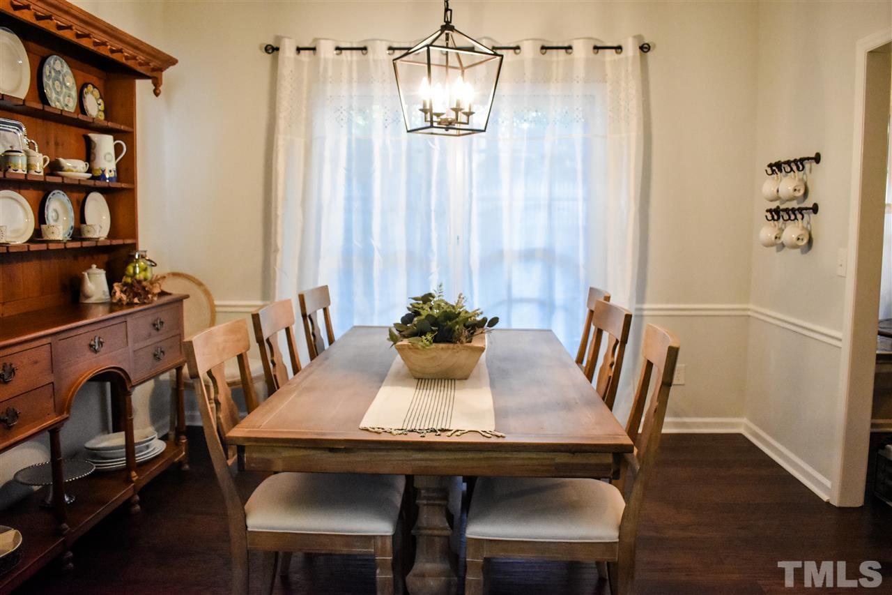 3417 Tunas Street Raleigh, NC 27616 - Photo 7 of 30 a view of a dining room with furniture window and wooden floor