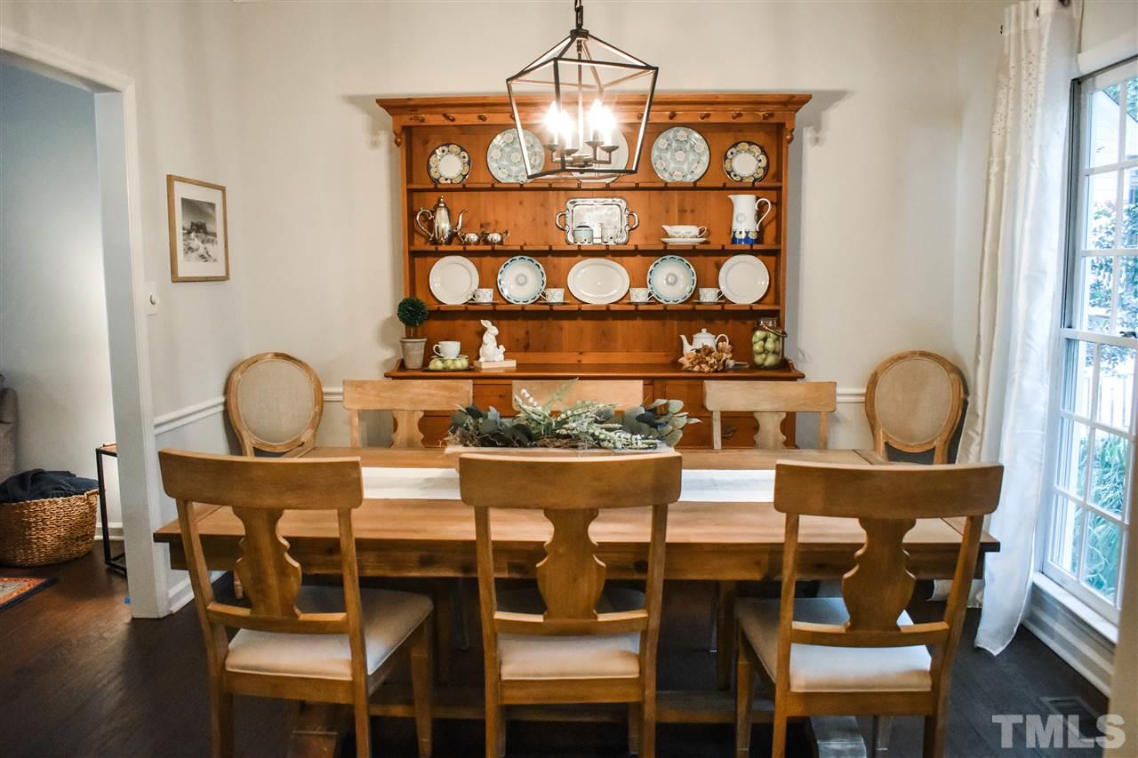 3417 Tunas Street Raleigh, NC 27616 - Photo 8 of 30 a view of a dining room with furniture and wooden floor