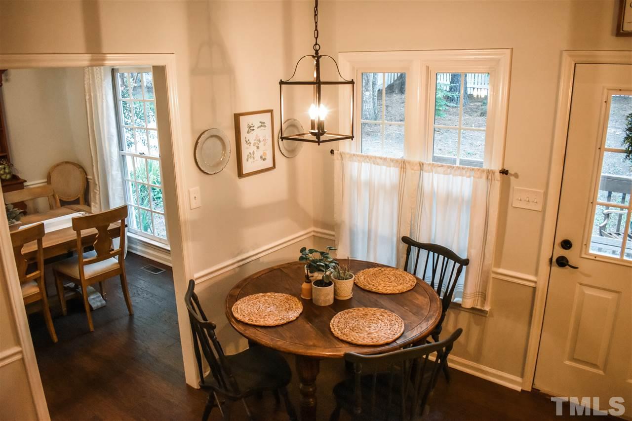 3417 Tunas Street Raleigh, NC 27616 - Photo 9 of 30 a view of a dining room with furniture and a chandelier