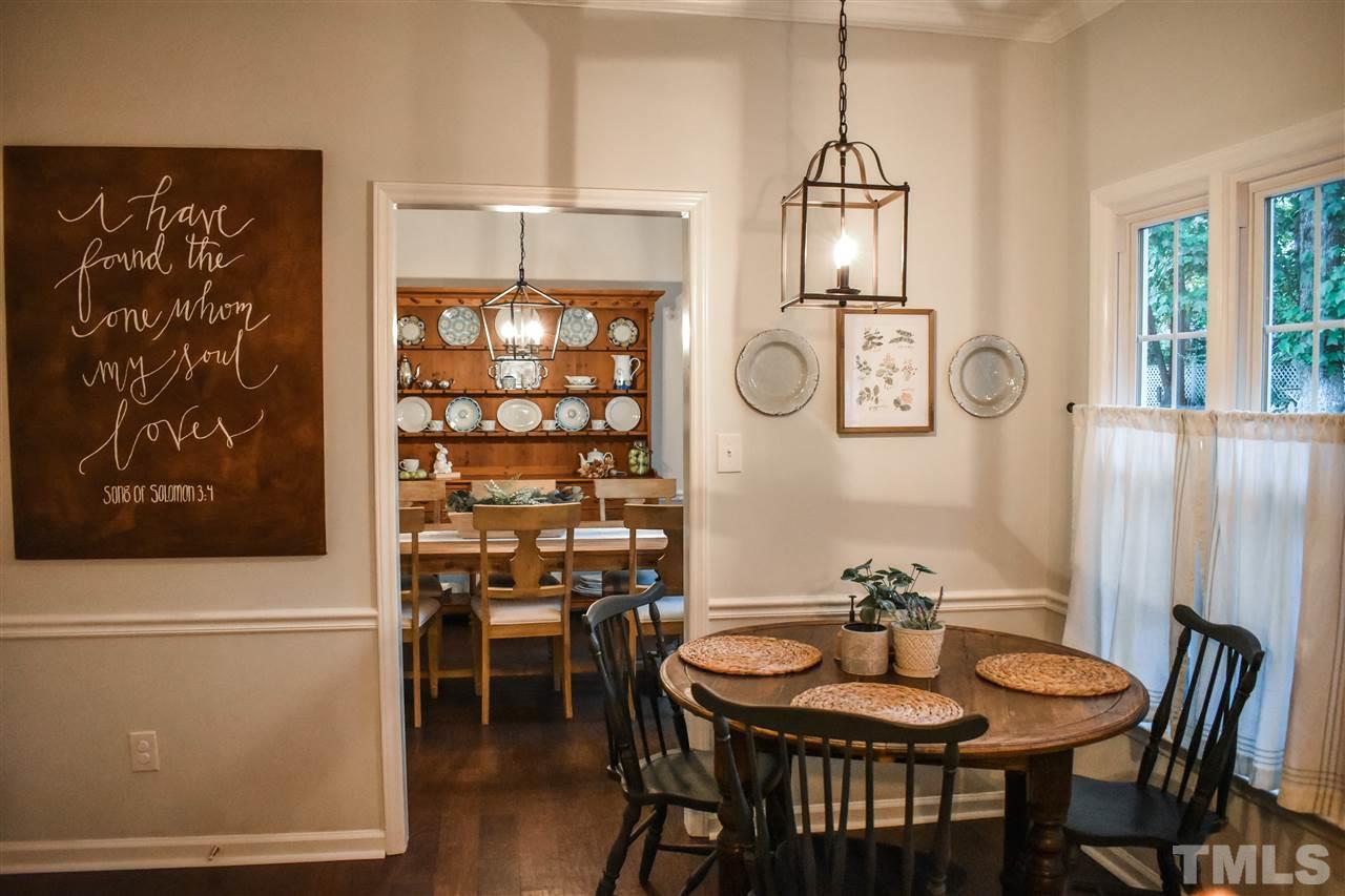 3417 Tunas Street Raleigh, NC 27616 - Photo 10 of 30 a view of a dining room with furniture and chandelier