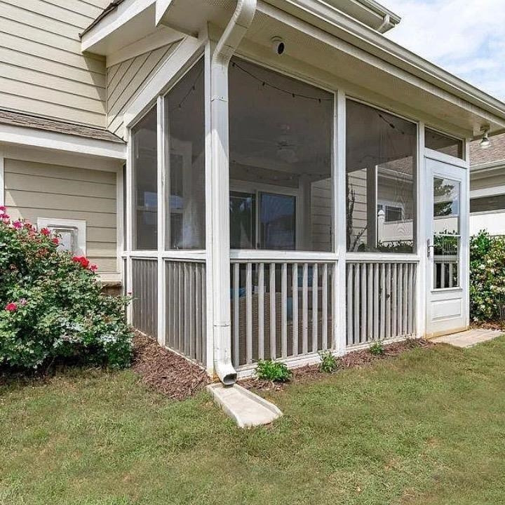 210 Mayfield Drive Apex, NC 27539 - Photo 2 of 3 a front view of a house with a garden