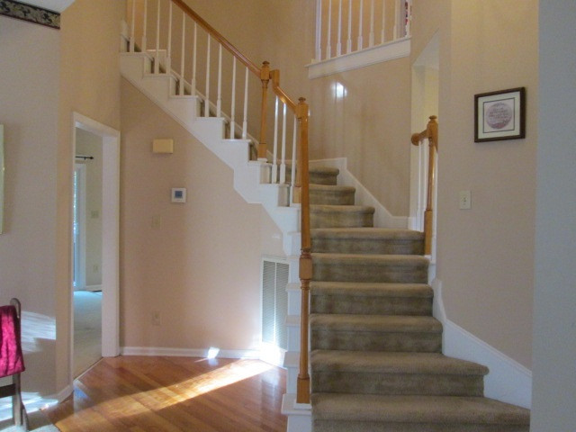 9721 Talman Court Raleigh, NC 27615 - Photo 3 of 30 Curved Staircase