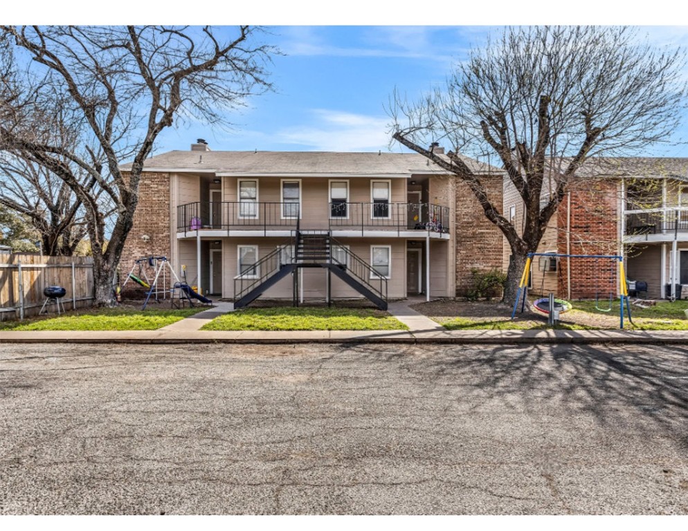 2012 West Loop Austin, TX 78758 - Photo 1 of 16 a view of a white house with a large pool and a yard