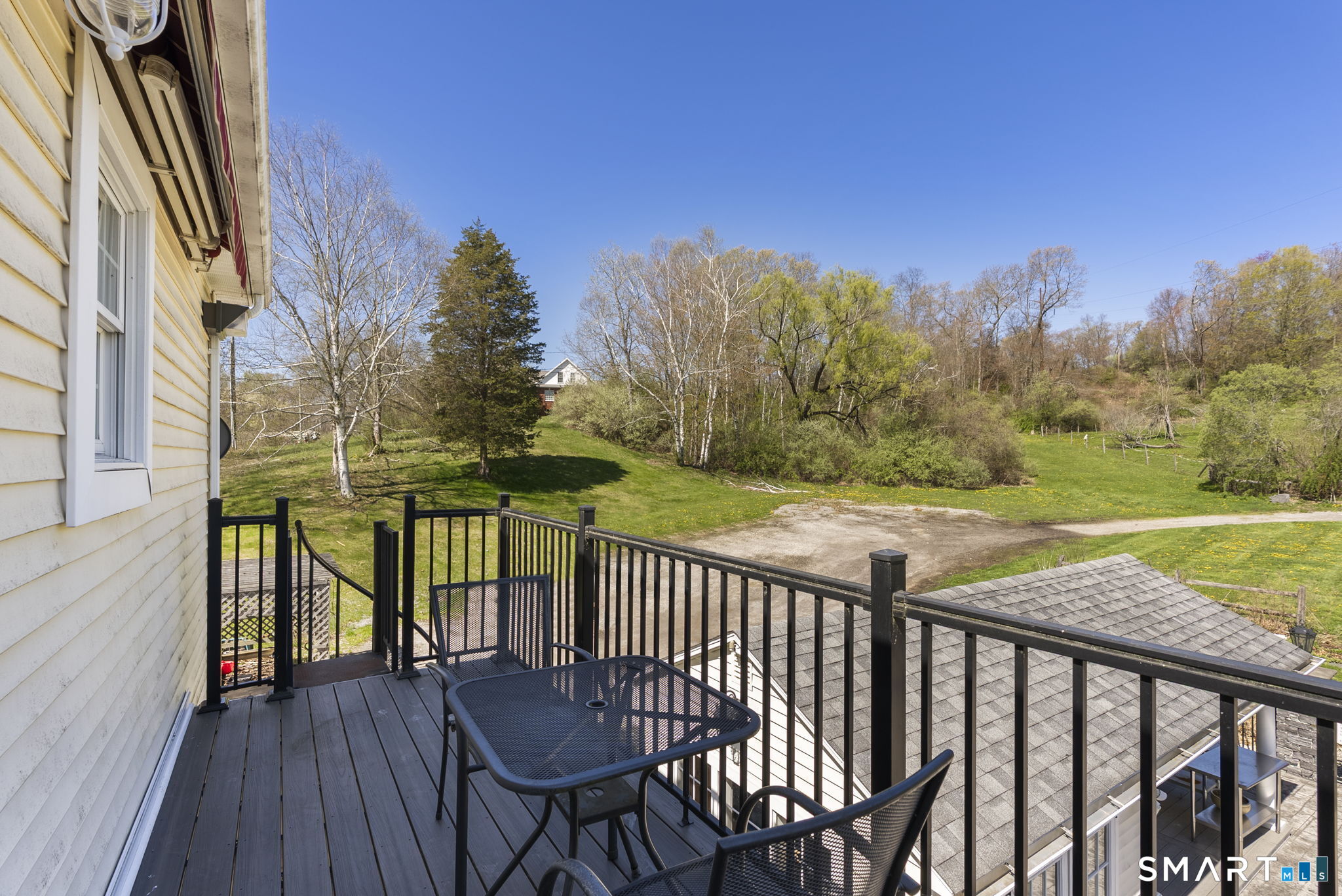341 High Street Extension Thomaston, CT 06787 - Photo 18 of 39 a view of a balcony with wooden floor & fence