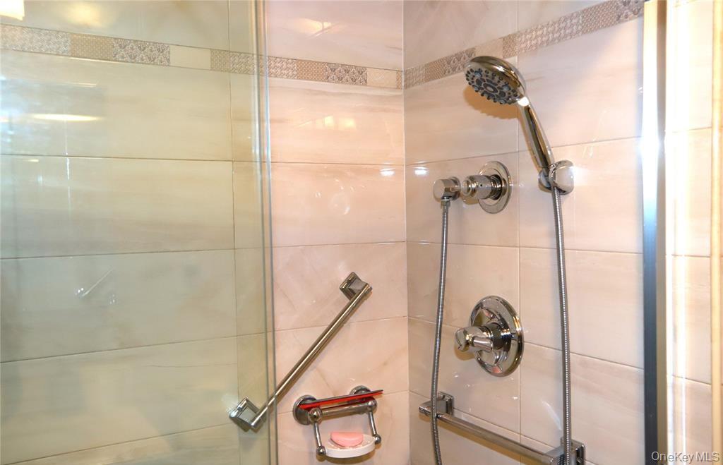 71-38 147th Street, Unit 27A Queens, NY 11367 - Photo 8 of 8 Full bath with a shower stall