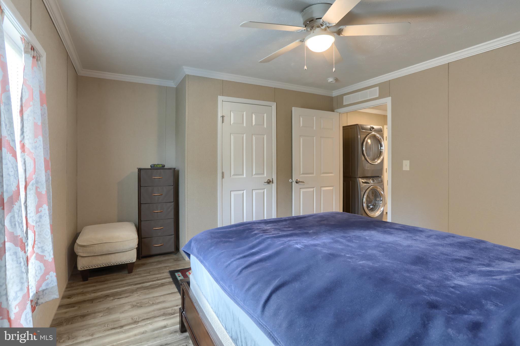 1300 East Kercher Avenue, Unit 32 Myerstown, PA 17067 - Photo 18 of 27 a bedroom with a bed and a chandelier