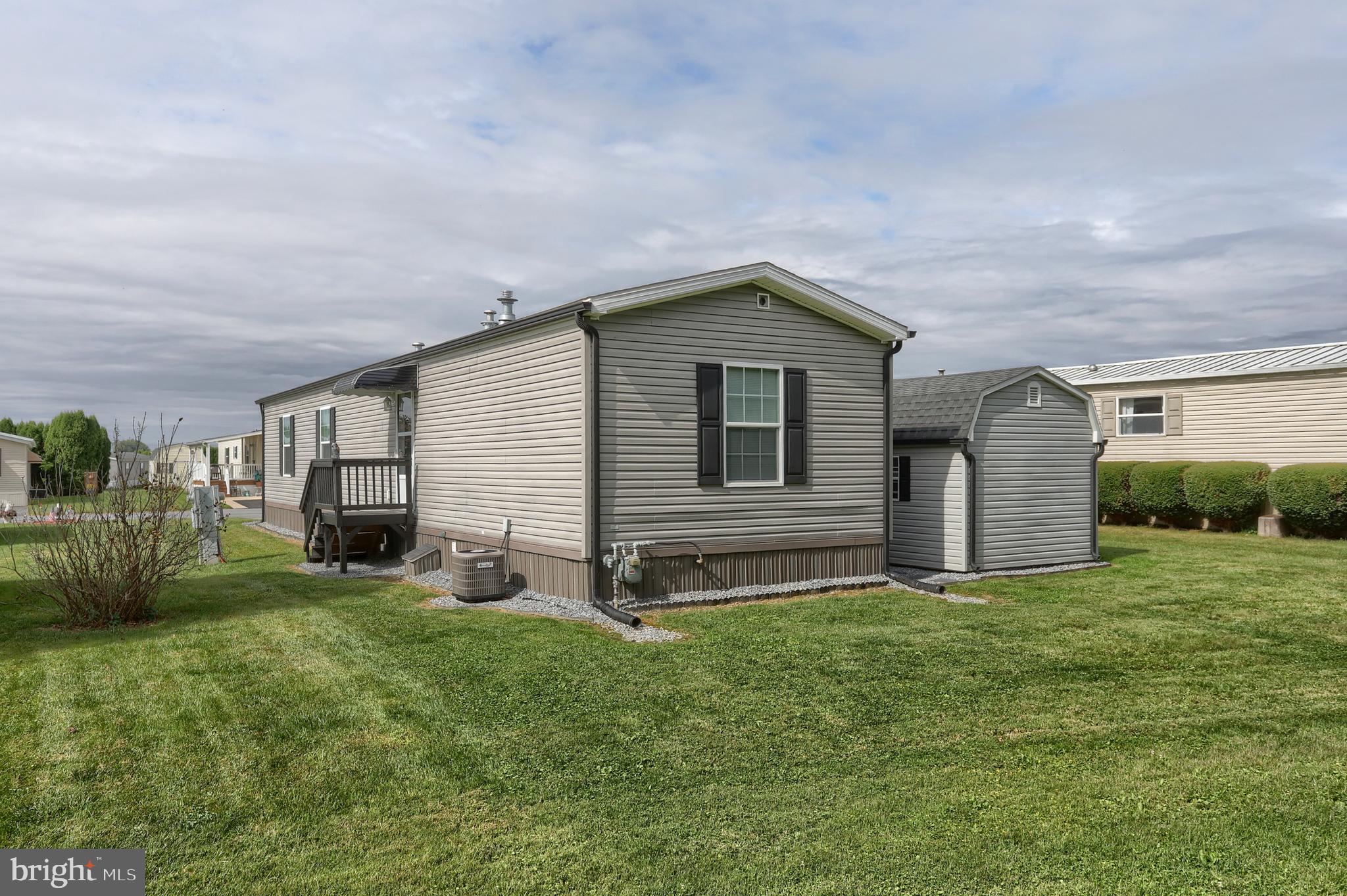 1300 East Kercher Avenue, Unit 32 Myerstown, PA 17067 - Photo 21 of 27 a front view of house with yard and green space