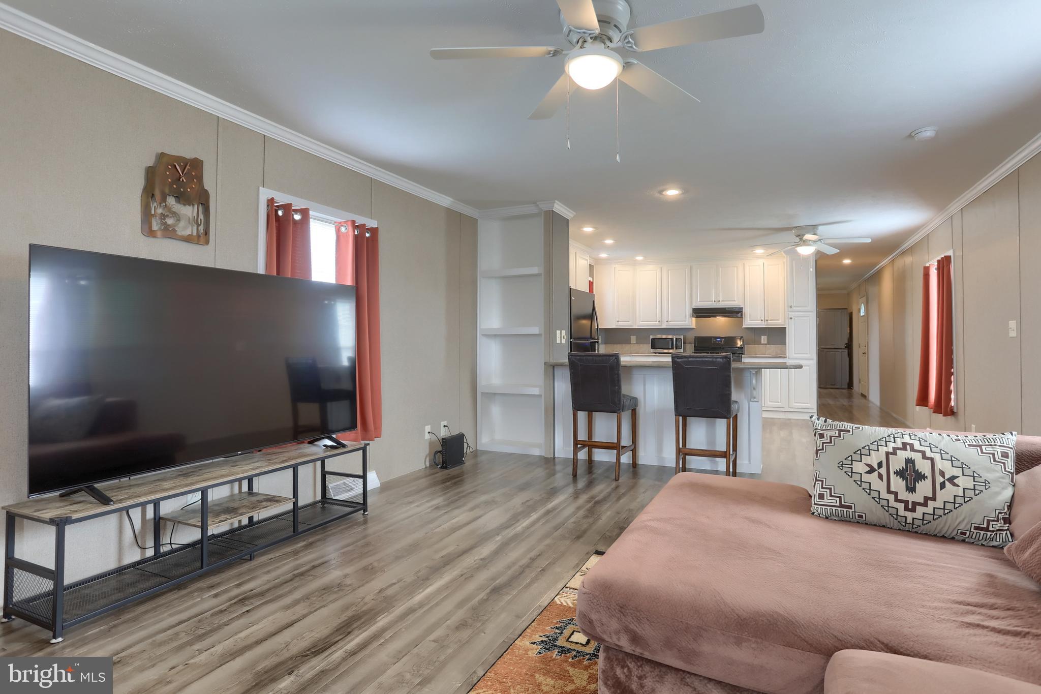 1300 East Kercher Avenue, Unit 32 Myerstown, PA 17067 - Photo 3 of 27 a living room with furniture and a flat screen tv