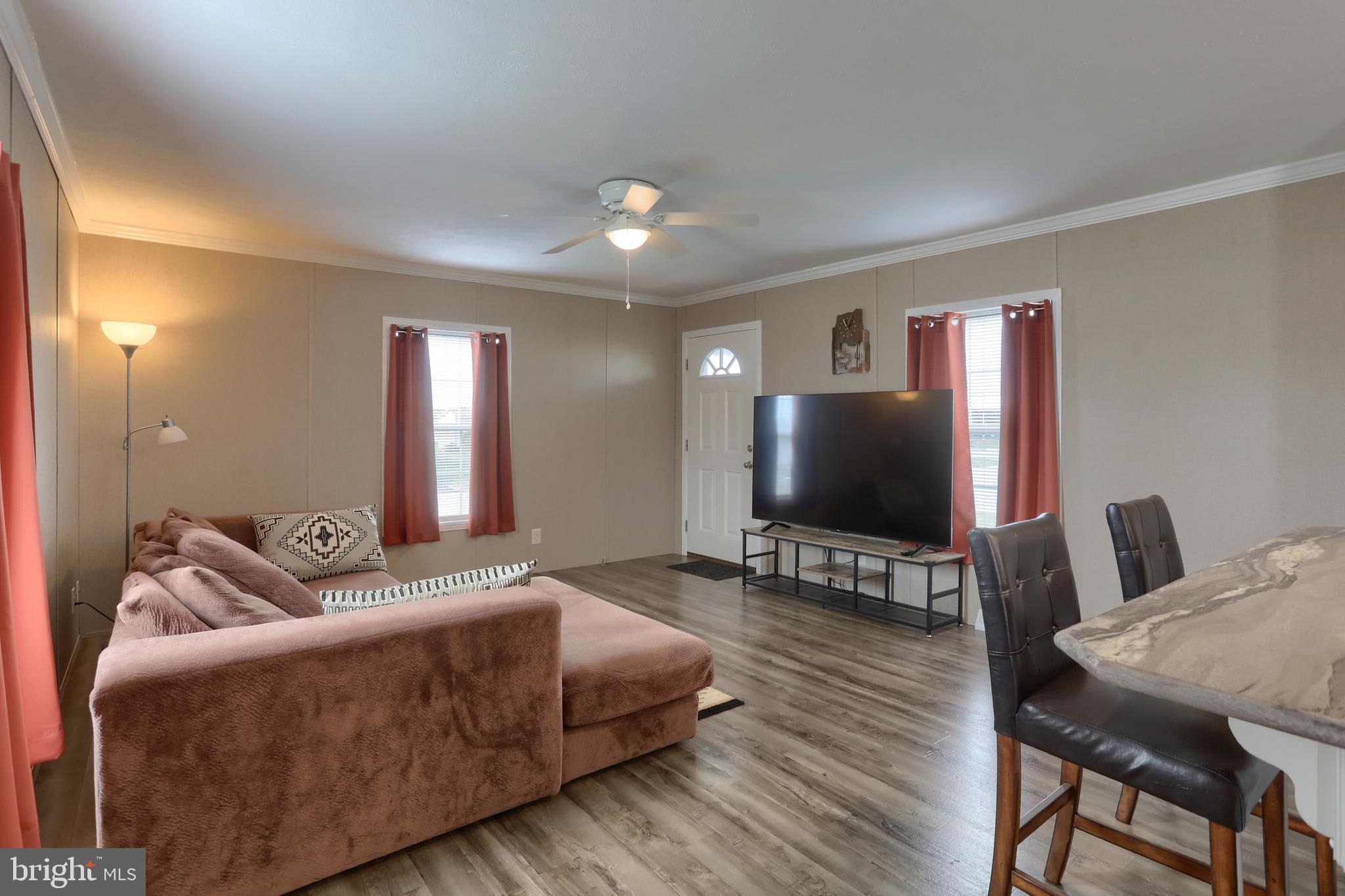 1300 East Kercher Avenue, Unit 32 Myerstown, PA 17067 - Photo 4 of 27 a living room with furniture and a flat screen tv