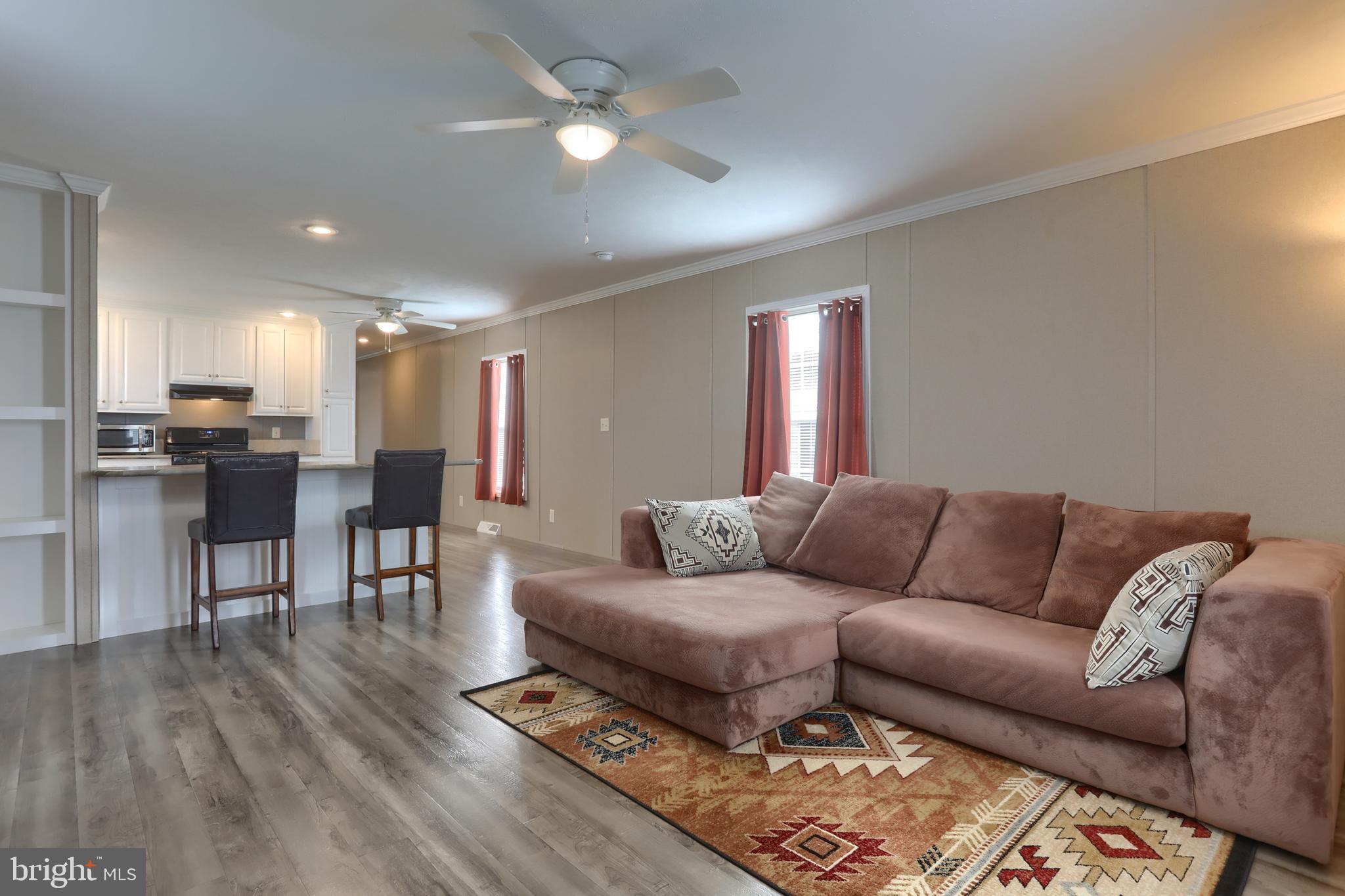 1300 East Kercher Avenue, Unit 32 Myerstown, PA 17067 - Photo 5 of 27 a living room with furniture and kitchen view