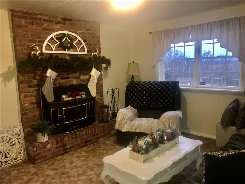 274 Malone Ridge Road Washington, PA 15301 - Photo 10 of 25 Family Room with Window & Decorative Brick Fireplace