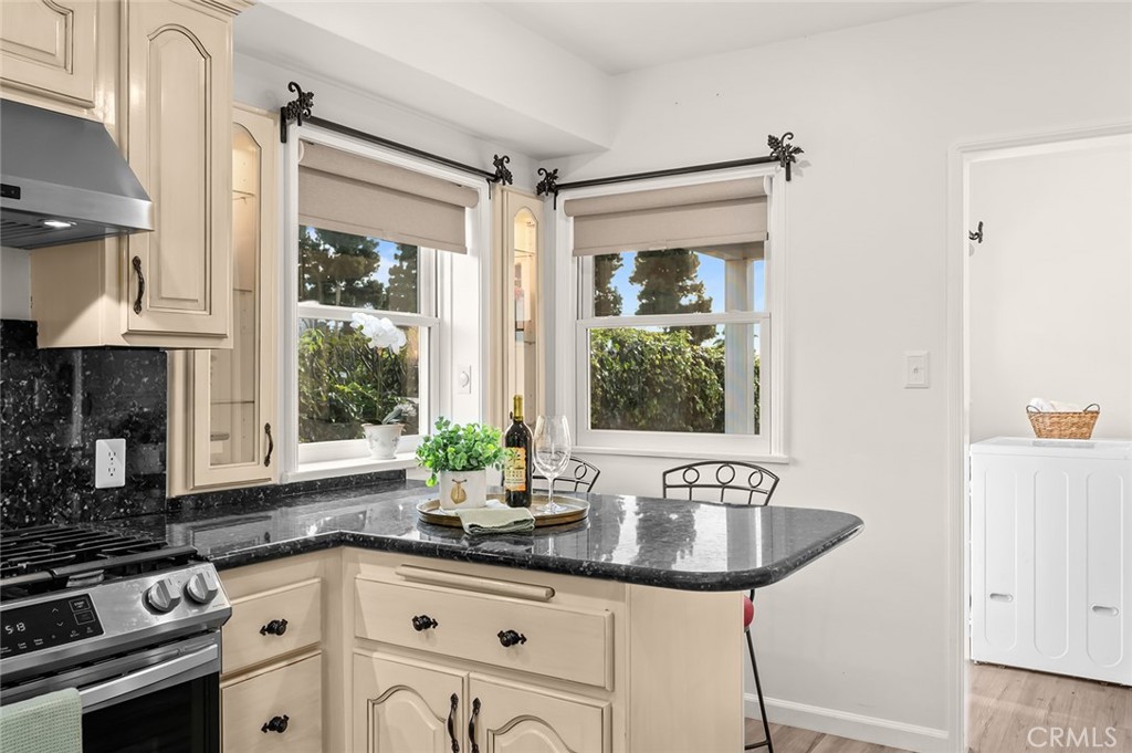5487 Cadbury Road Whittier, CA 90601 - Photo 19 of 73 a kitchen with granite countertop a sink cabinets and window