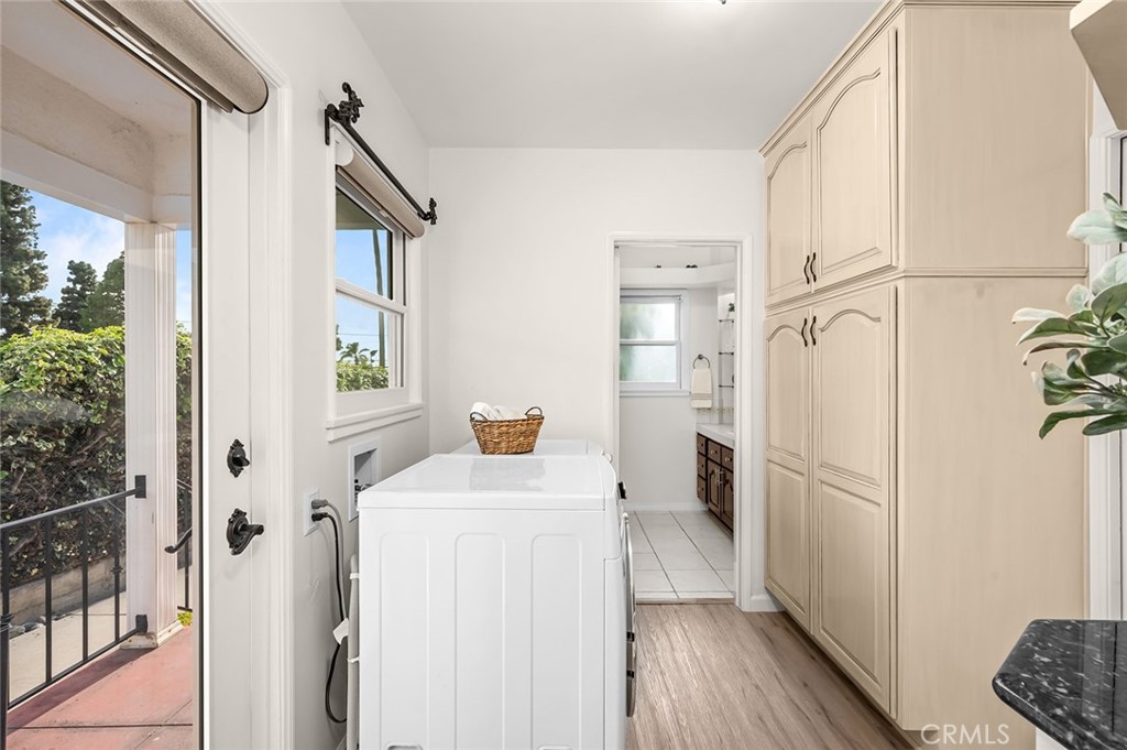 5487 Cadbury Road Whittier, CA 90601 - Photo 20 of 73 a kitchen with stainless steel appliances a refrigerator sink and wooden floor