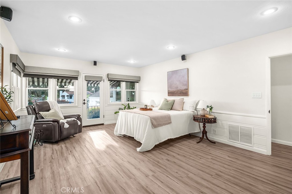5487 Cadbury Road Whittier, CA 90601 - Photo 24 of 73 a bed room with furniture and a wooden floor