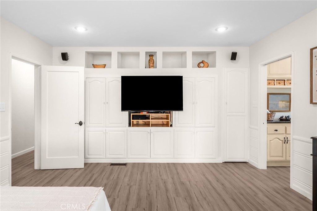 5487 Cadbury Road Whittier, CA 90601 - Photo 28 of 73 a view of a livingroom with wooden floor and a flat screen tv