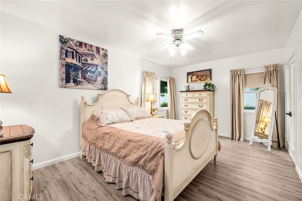 5487 Cadbury Road Whittier, CA 90601 - Photo 30 of 73 a bedroom with a bed and a chandelier