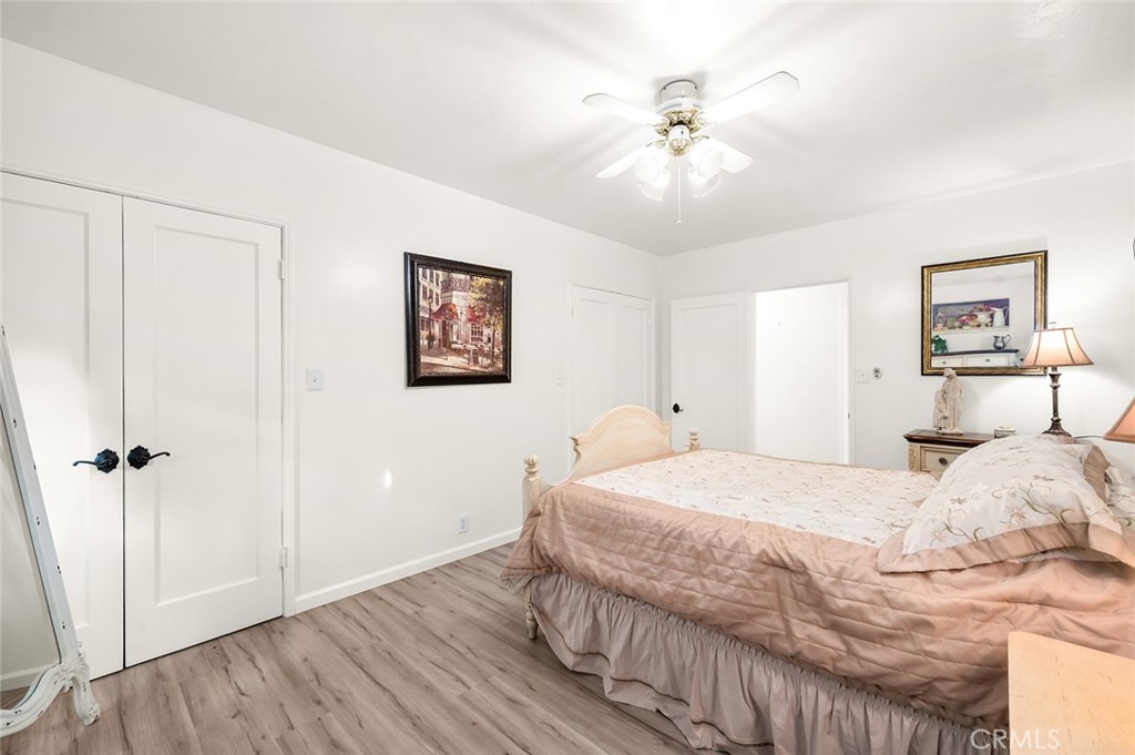 5487 Cadbury Road Whittier, CA 90601 - Photo 31 of 73 a bedroom with a bed and a chandelier