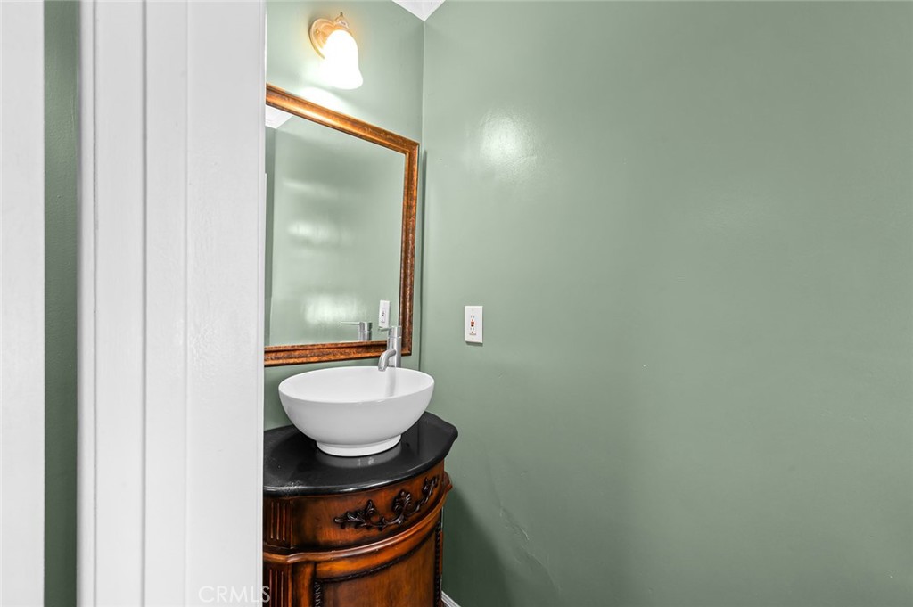 5487 Cadbury Road Whittier, CA 90601 - Photo 52 of 73 a bathroom with a sink and a mirror