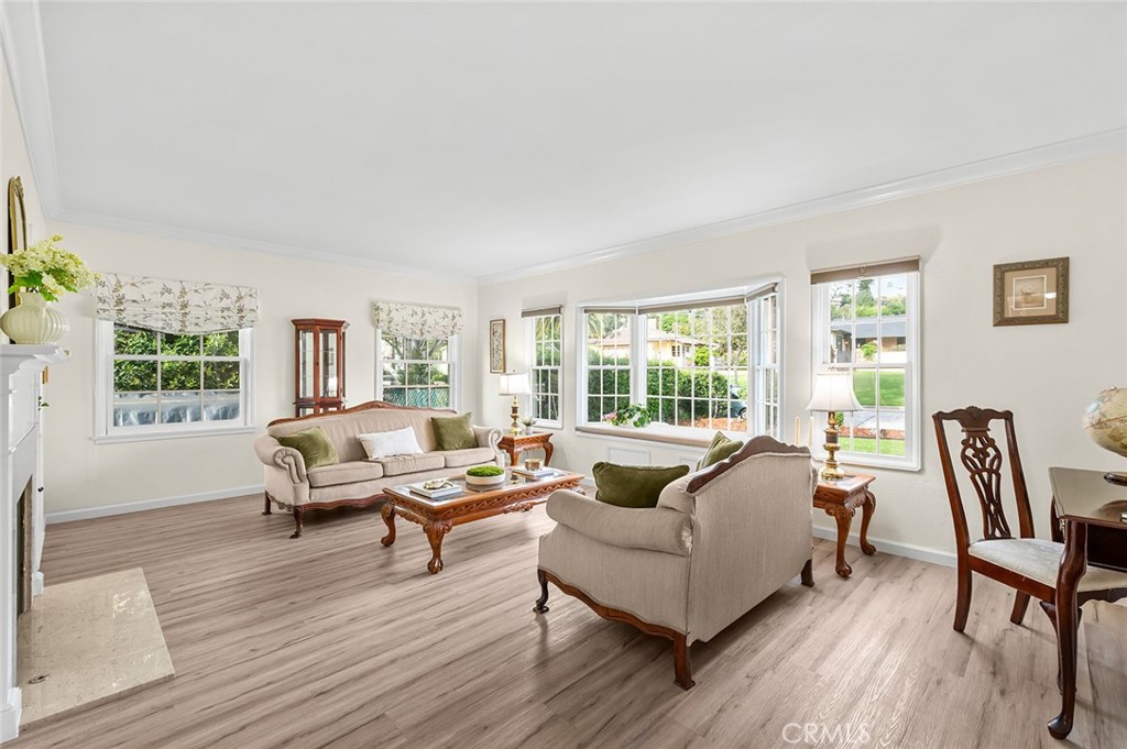 5487 Cadbury Road Whittier, CA 90601 - Photo 7 of 73 a living room with furniture and a wooden floor