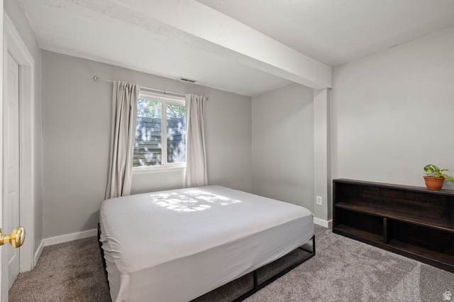 594 850 West Provo, UT 84601 - Photo 26 of 33 Bedroom featuring a window with natural light, neutral wall paint, and gray carpet flooring
