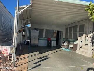 702 South Meridian Road, Unit 52 Apache Junction, AZ 85120 - Photo 10 of 16 a view of a porch with a bench