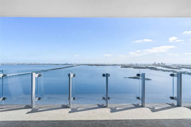 a view of a livingroom with wooden floor and stairs