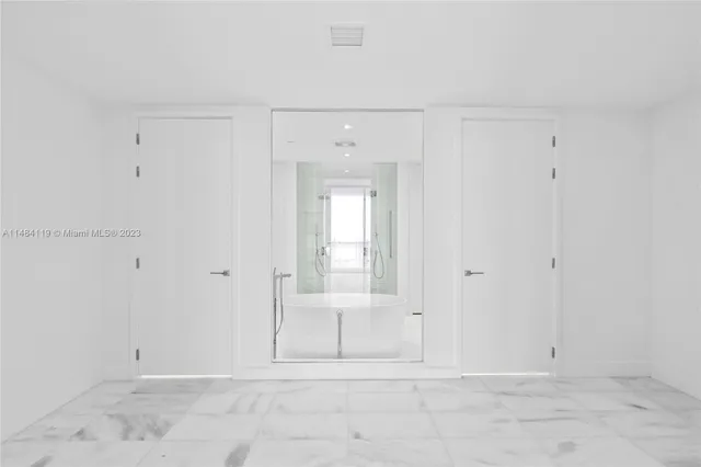 a bathroom with a granite countertop sink a toilet and shower