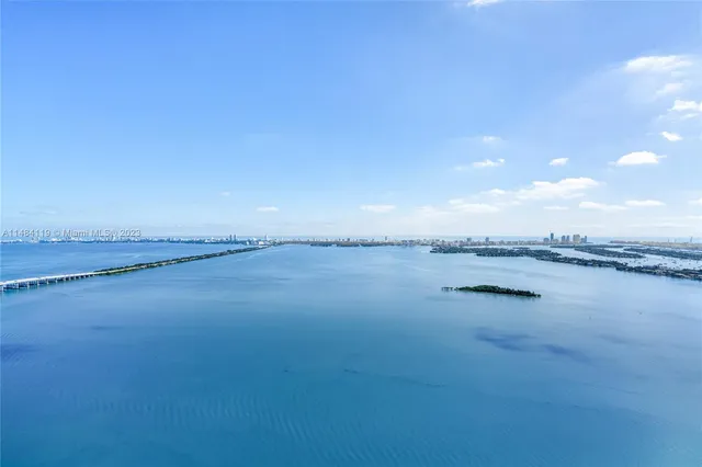 a view of an ocean and mountain